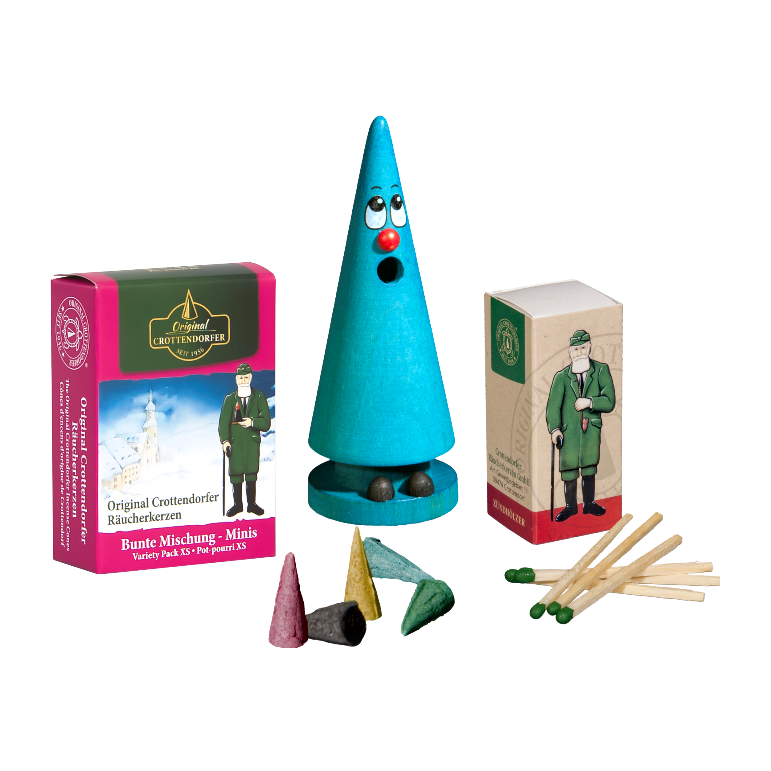 Das Mini-Räucherset ‚Leo Lavendel‘ von Original Crottendorfer Räucherkerzen beinhaltet einen türkisfarbenen, gesichtsförmigen Räucherkegel, bunte Räucherkerzenkegel, Streichhölzer und eine illustrierte Verpackungsschachtel und bietet so ein zauberhaftes und einzigartiges Räuchererlebnis.