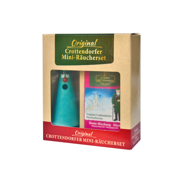 Das „Mini-Räucherset ‚Leo Lavendel‘“ von Original Crottendorfer Räucherkerzen besticht durch einen verspielten blauen, kegelförmigen Räucherstövchen mit überraschendem Blick. Es enthält verschiedene Mini-Räucherkerzen und die Abbildung einer Figur in Tracht, die ein herrliches Dufterlebnis verspricht.