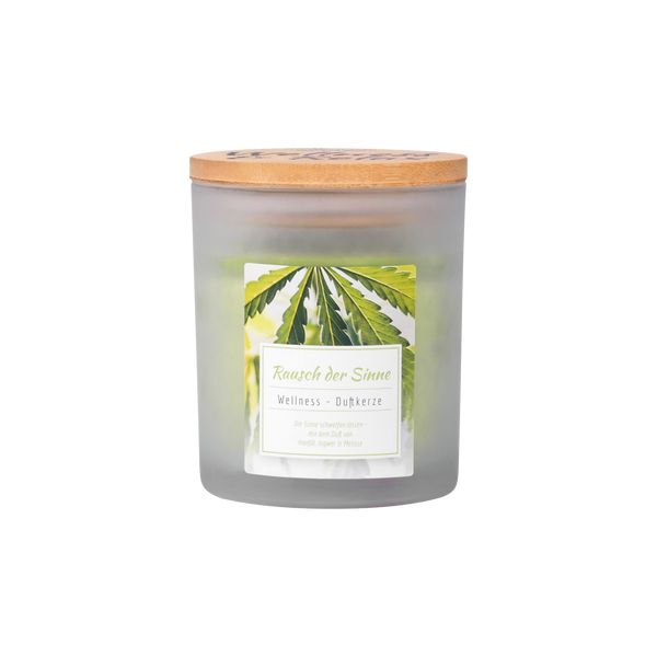 Ein Milchglas-Kerzengefäß mit Holzdeckel von Candle Factory. Auf dem Etikett steht Wellness-Duftkerze "Rausch der Sinne" mit grünen Blättern, mit Stearin - ideal für Fans von Wellness-Duftkerzen und Naturkosmetik.