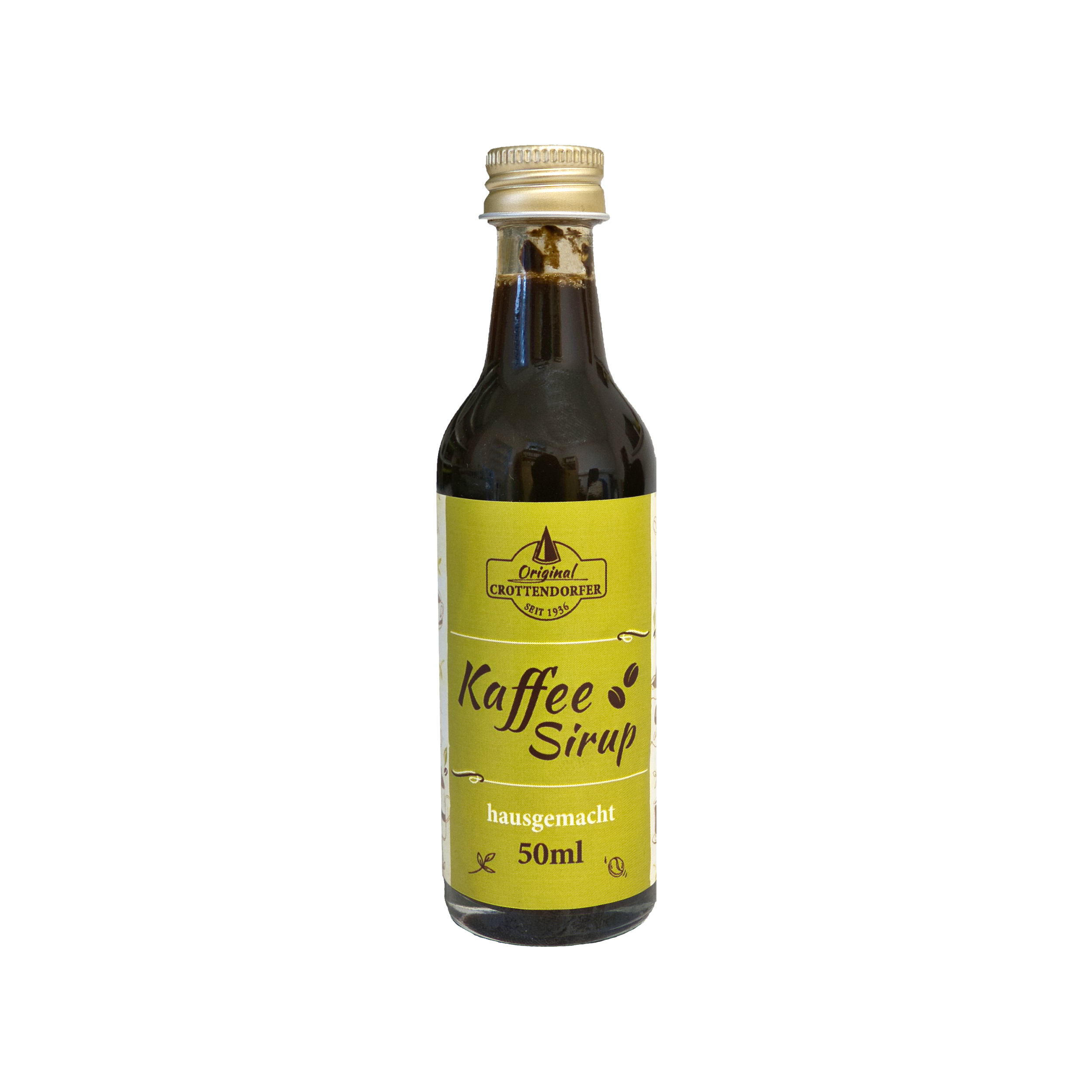 Der Original Crottendorfer Hausgemachter Kaffeesirup ist in einer 50-ml-Glasflasche mit gelbem Etikett mit den Aufschriften „Kaffeesirup“ und „hausgemacht“ erhältlich und eignet sich ideal für Eiskaffee oder Cocktails. Die dunkle Flüssigkeit ist mit einem Schraubverschluss auf schwarzem Hintergrund verschlossen.
