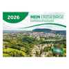 Der Curth Verlag Kalender "Mein Erzgebirge" 2026 zeigt ein grün-weißes Cover mit der Luftaufnahme einer erzgebirgischen Hügellandschaft, Wäldern, Häusern und blauem Himmel - ideal für Veranstaltungen und Ausflugtipps in der Region.