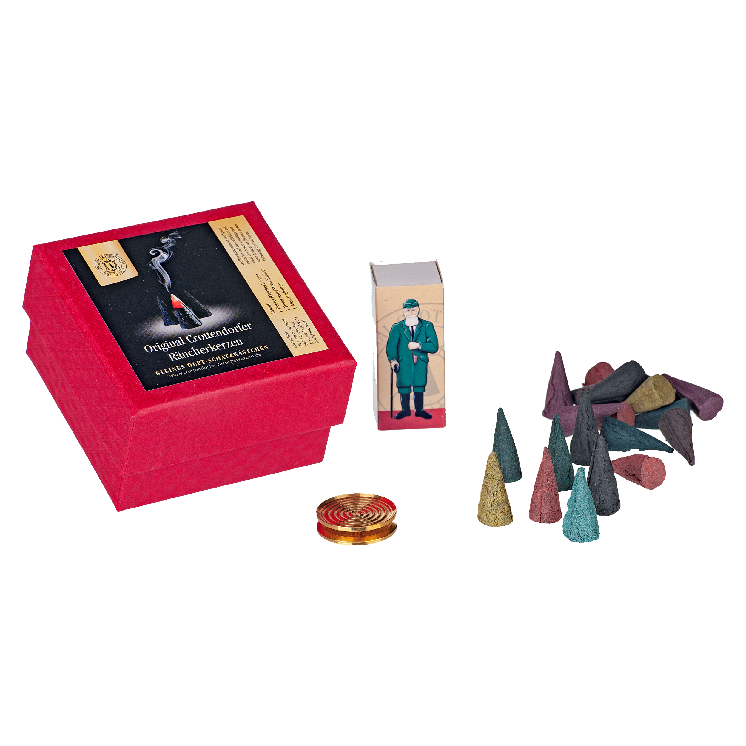 Die Geschenkbox „Wunschduft“ von Original Crottendorfer Räucherkerzen enthält eine rote Box mit bunten Räucherkerzen und eine kleine goldene Messingschale. Auf einer kleineren Packung daneben ist ein Mann in Grün abgebildet, der die Tradition des Weihrauchverbrennens darstellt.