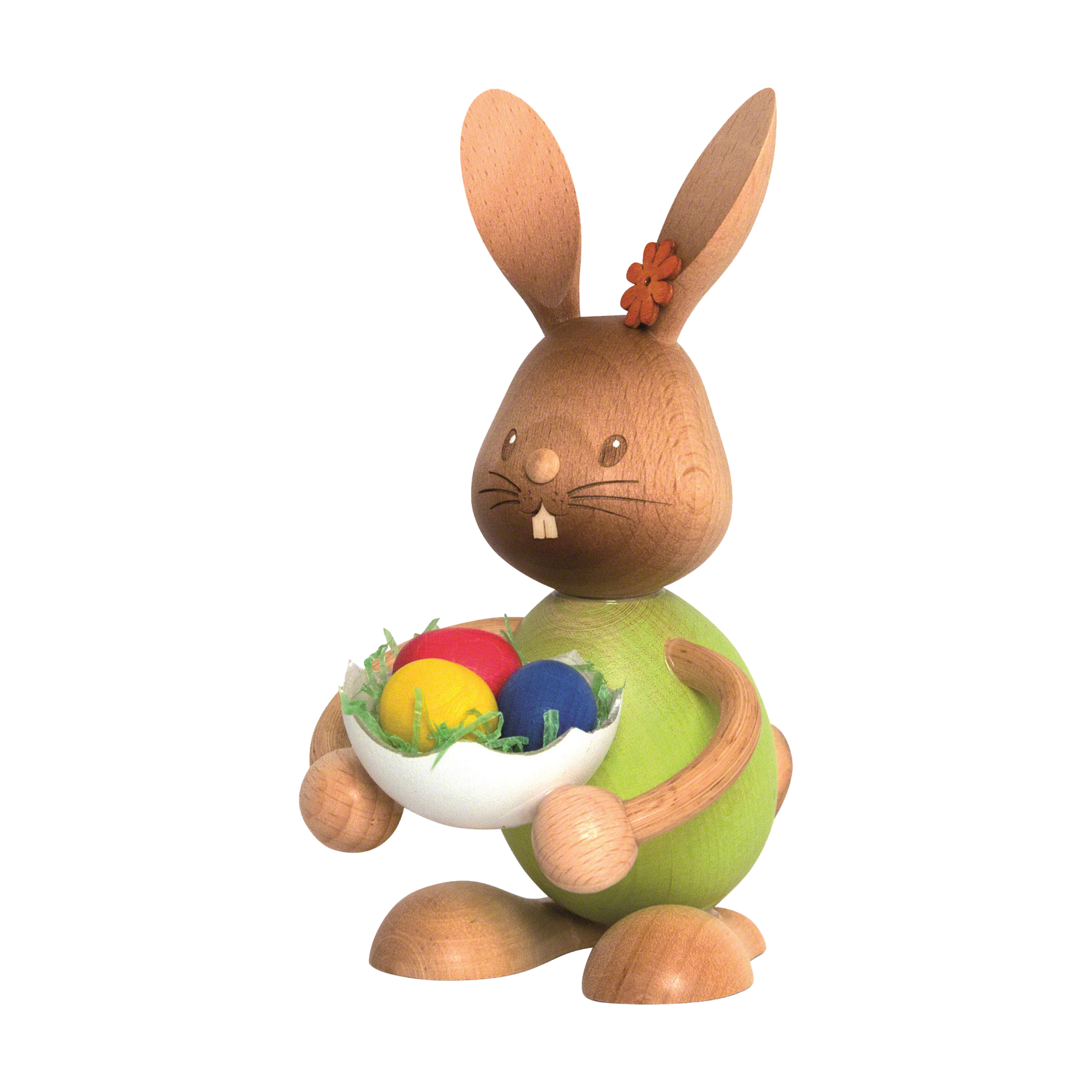 Der Stupsi Hase mit Eierschale von Drechslerei Kuhnert ist eine Holzfigur mit grünem Körper und einer Schale mit bunten Ostereiern. Er hat eine Blume am Ohr, einen fröhlichen Gesichtsausdruck und zeigt feine Handwerkskunst.
