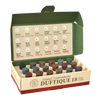 Eine geöffnete Schachtel mit der Aufschrift „Duftique 18 feine Düfte – Blumen & Früchte, Weltreise & Sinnliche Magie“ von Original Crottendorfer Räucherkerzen präsentiert 18 farbenfrohe Duftkegel in Reihen, die jeweils mit einem Duftnamen und einer Nummer auf der Innenseite des Deckels versehen sind und eine Weltreise durch blumige, fruchtige und holzige Düfte für eine exquisite Duftauswahl bieten.
