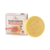 Ein rundes gelbes Stück Ovis Duschseife Grapefruit-Orange liegt neben der Schachtel, die Bilder von Grapefruit und Orange zeigt und den Duft als Grapefruit-Orange kennzeichnet.