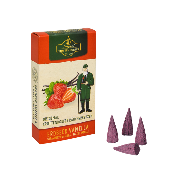 Die Schachtel „Räucherkerzen Erdbeer Vanille“ von Original Crottendorfer Räucherkerzen ist mit Erdbeeren, mexikanischer Vanille und einer grün gekleideten Figur illustriert, begleitet von drei violetten Weihrauchzapfen. Das Etikett beschwört die Wärme von Sommerfrüchten herauf.
