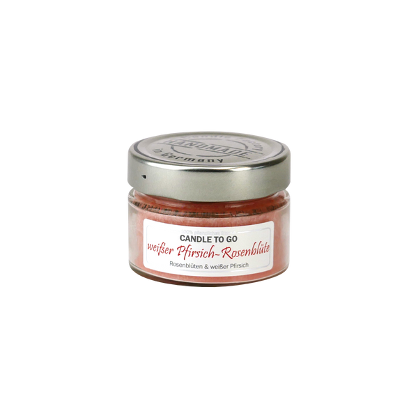 Das kleine Glasgefäß mit Metalldeckel von Candle Factory beinhaltet die natürliche Duftkerze „Candle to go“ mit dem herrlichen Duft weißer Pfirsich-Rosenblüte, der weiße Pfirsich und Rosenblüte vereint.