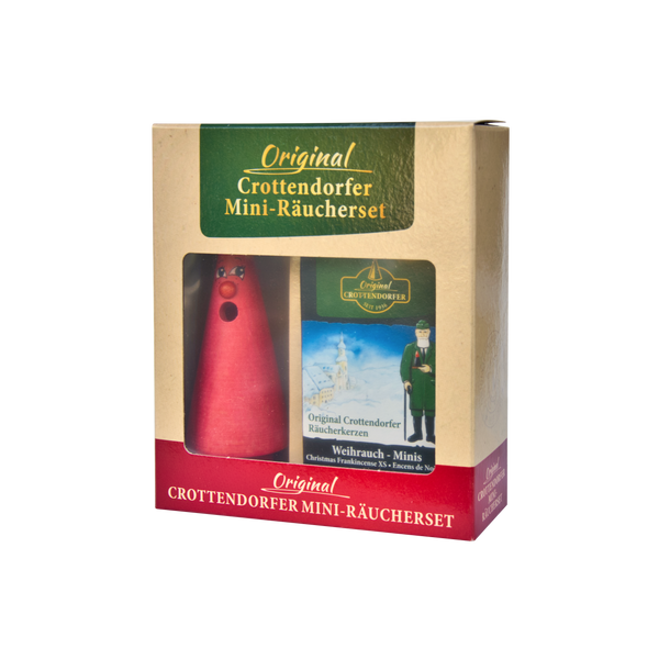 Die Verpackung zeigt ein rotes, kegelförmiges Räuchermännchen und Mini-Räucherkegel. Das Etikett „Mini-Räucherset ‚Romy Rose‘“ von Original Crottendorfer Räucherkerzen ist mit weihnachtlichen Motiven und deutschem Text verziert. Ideal, um weihnachtliche Weihrauch-Momente zu genießen.