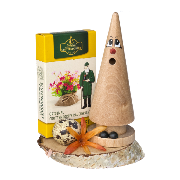 Das Geschenkset Ostern Ziegenbein + Räucherkerzen von Original Crottendorfer Räucherkerzen besteht aus einem hölzernen Räucherkegel, Räucherkegeln, einer dekorativen Schleife und einem gesprenkelten Ei - perfekt als Ostergeschenk.