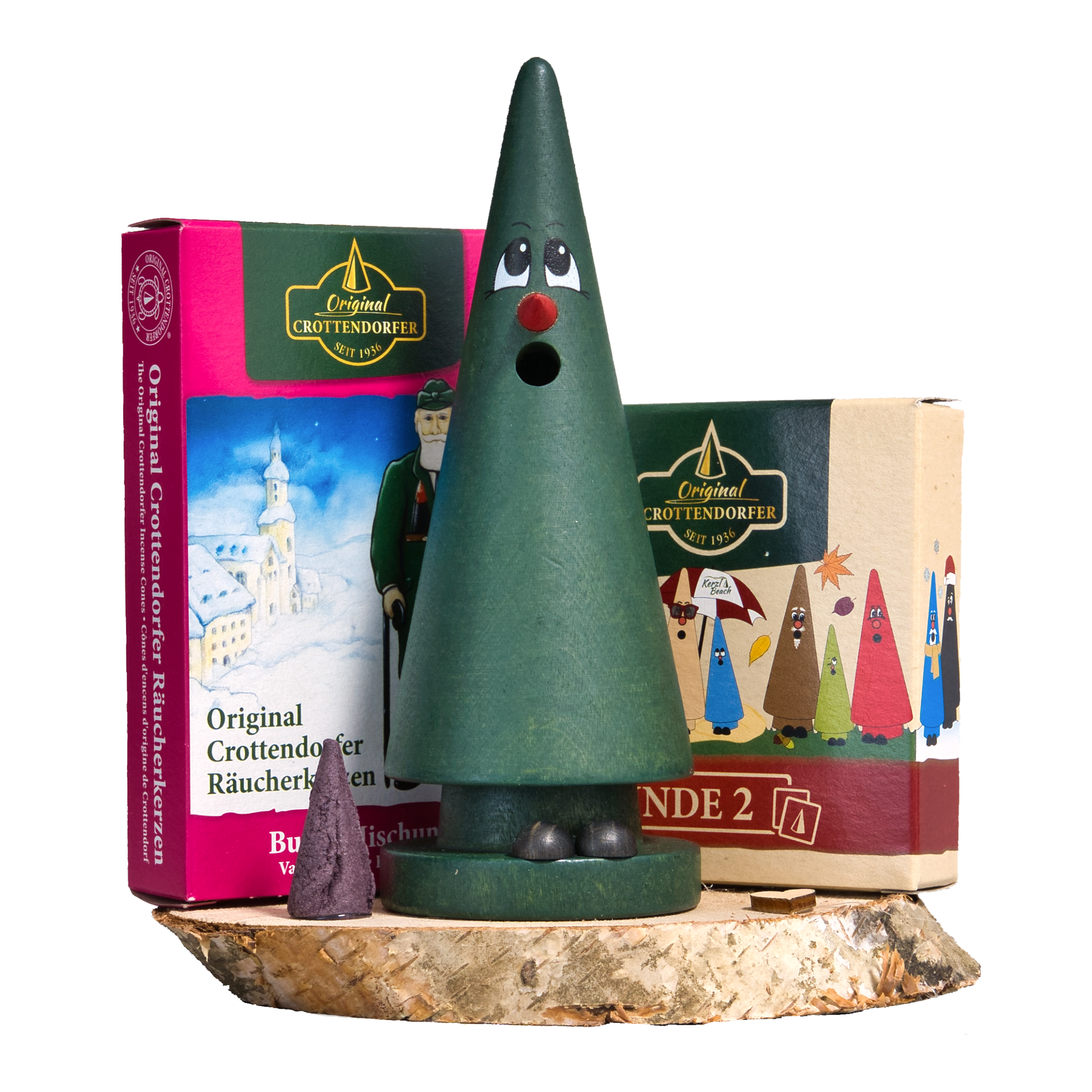 Das Geschenkset Tina Tanne mit Räucherkerzen und Memo-Spiel von Original Crottendorfer Räucherkerzen zeigt eine grüne, kegelförmige Räuchermaschine aus Holz auf einem Sockel, mit zwei Schachteln Räucherkegel und einem lila Kegel im Hintergrund.