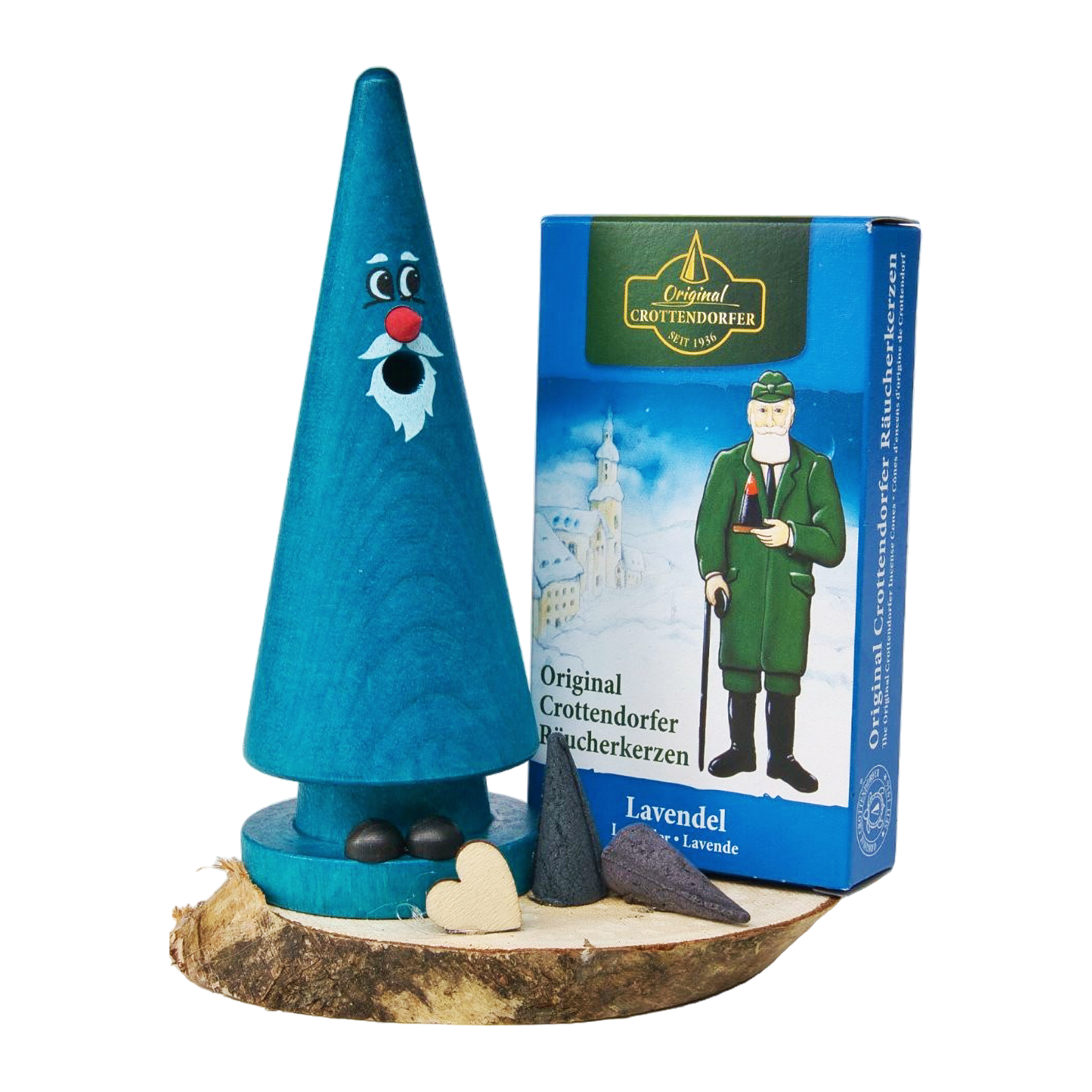 Das Geschenkset „Ziegenbein + Räucherkerzen“ von Original Crottendorfer Räucherkerzen besteht aus einer blauen Holzfigur mit Gesicht und Bart auf einem Sockel, die zusammen mit Herzformen und Räucherkegeln neben einer blauen Schachtel mit der Abbildung eines Mannes in Uniform präsentiert wird.