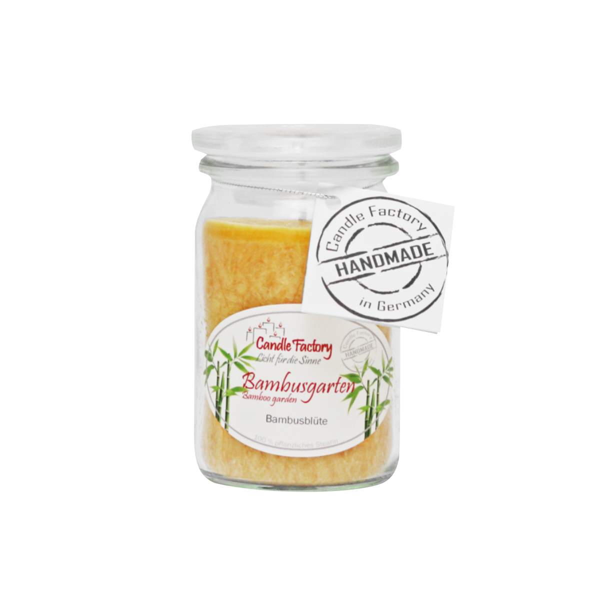 Eine gelbe Wachskerze aus Weckglas, beschriftet mit Candle Factory Duftkerze/Windlicht 