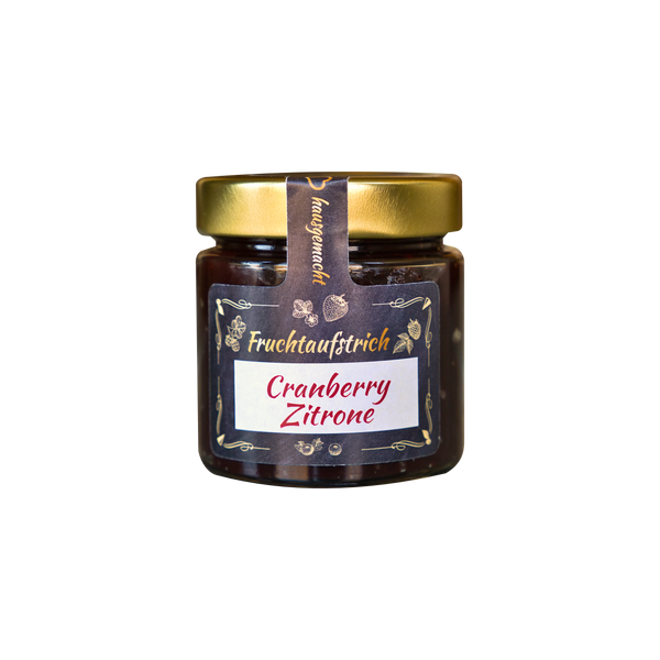 Ein 200-g-Glas mit Original Crottendorfer Hausgemachter Fruchtaufstrich mit goldenem Deckel und einem dekorativen deutschen Etikett, das darauf hinweist, dass er vegan und laktosefrei ist; das Glas enthält einen dunkelroten Fruchtaufstrich und steht auf einem schlichten weißen Hintergrund.
