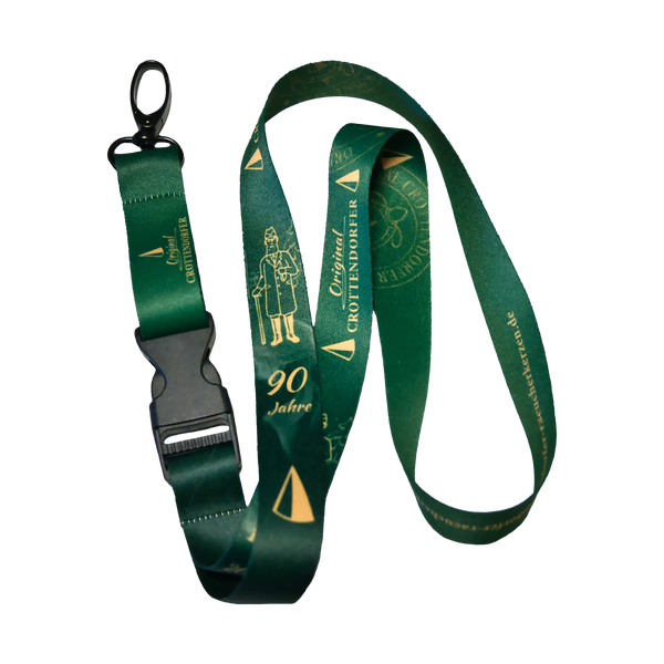 Das grüne Schlüsselband "90 Jahre Original Crottendorfer 1936-2016" der Marke Original Crottendorfer besteht aus edlem Satin mit goldener Prägung, schwarzem Kunststoffverschluss und Metallclip - ideal zum Jubiläum.