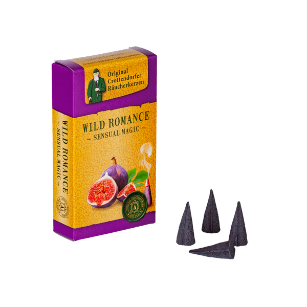 Eine Schachtel „Räucherkerzen Wild Romance“ von Original Crottendorfer Räucherkerzen zeigt ein violettes und gelbes Design mit künstlichen Bildern sowie drei aromatische dunkle Zapfen.