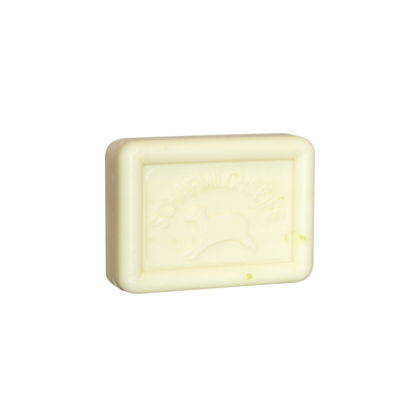 Ovis Schafmilchseife Ingwer-Limette ist ein rechteckiger, cremefarbener Riegel mit Schafprägung, der sanfte Reinigung und Pflege aus Schafmilch mit dem erfrischenden Duft von Ingwer-Limette bietet.